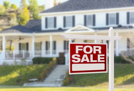 for sale sign in front of residential home